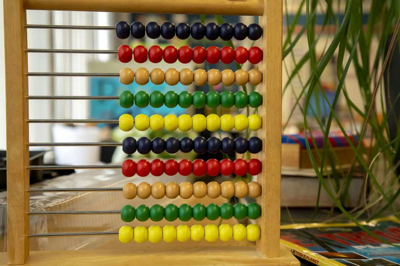 Wooden bead abacus in a sunny classroom